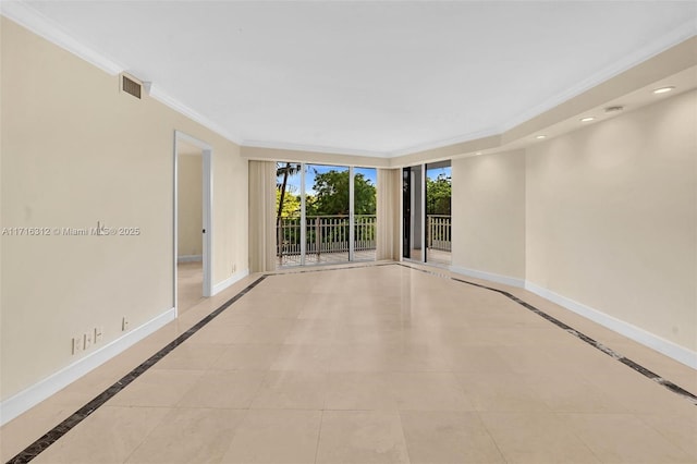 empty room with light tile patterned flooring and ornamental molding