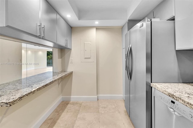 kitchen with stainless steel appliances, gray cabinetry, and light stone counters