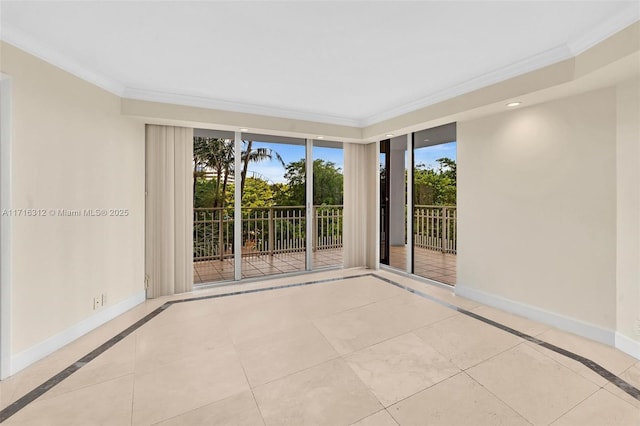 tiled spare room with a wealth of natural light and crown molding