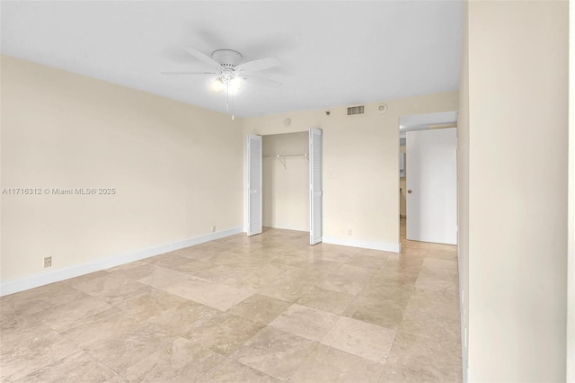 unfurnished room featuring ceiling fan