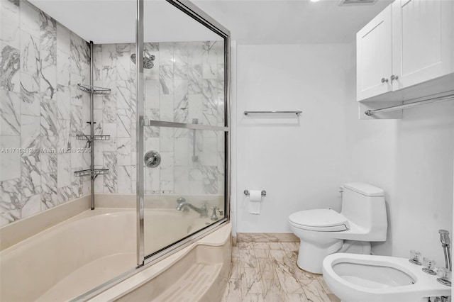 bathroom featuring shower / bath combination with glass door, a bidet, and toilet