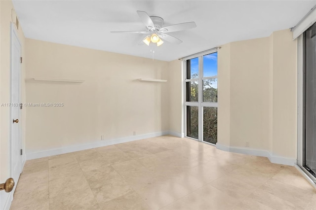 spare room featuring ceiling fan