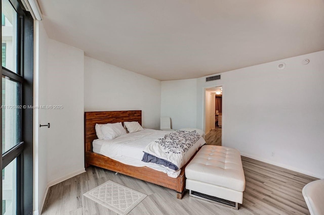 bedroom with light hardwood / wood-style floors