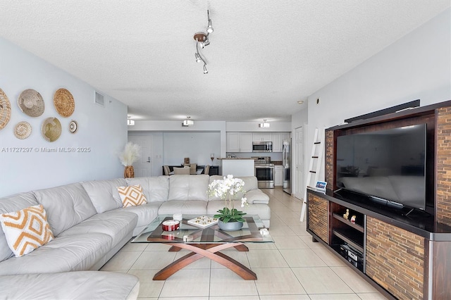 tiled living room with a textured ceiling