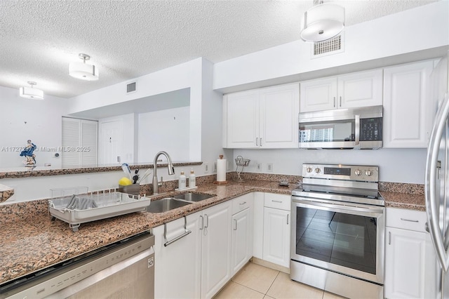 kitchen with white cabinets, sink, and stainless steel appliances