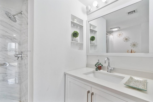 bathroom featuring a shower with shower curtain and vanity