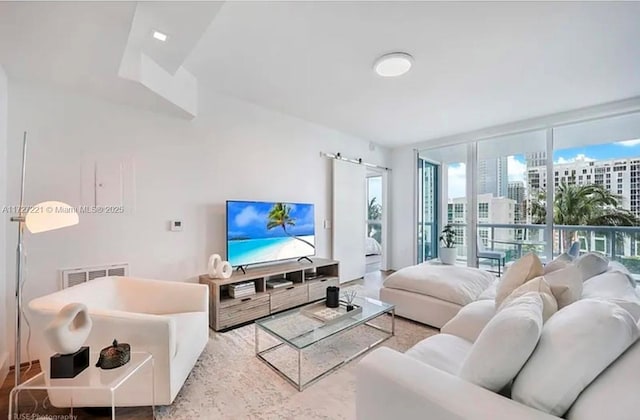 living room with floor to ceiling windows