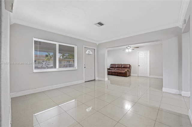 entrance foyer featuring light tile patterned floors, ornamental molding, and ceiling fan