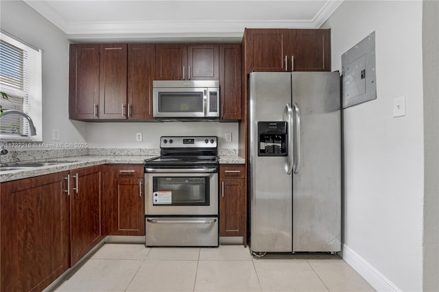 kitchen featuring sink, ornamental molding, stainless steel appliances, and electric panel