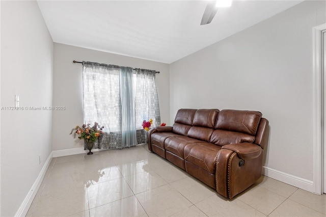 living room with ceiling fan and light tile patterned floors