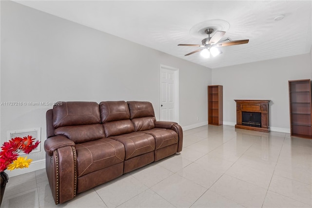 living room featuring ceiling fan and light tile patterned flooring