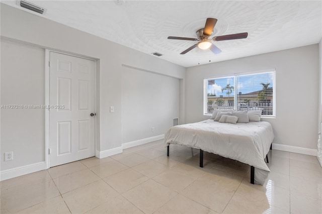 bedroom featuring ceiling fan and light tile patterned flooring