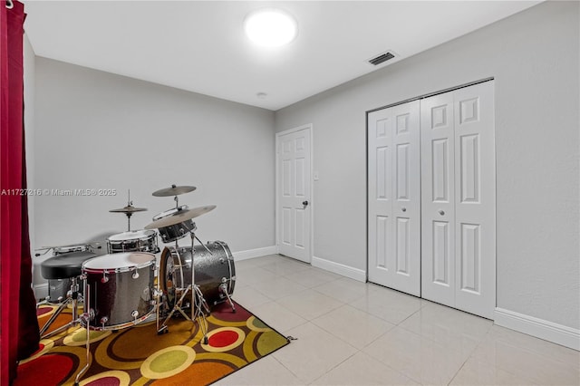 game room with light tile patterned floors