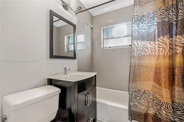 full bathroom featuring toilet, vanity, crown molding, and shower / tub combo