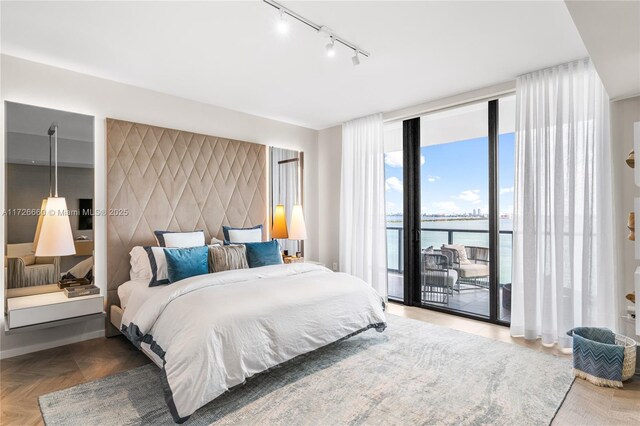 living room with expansive windows and parquet flooring