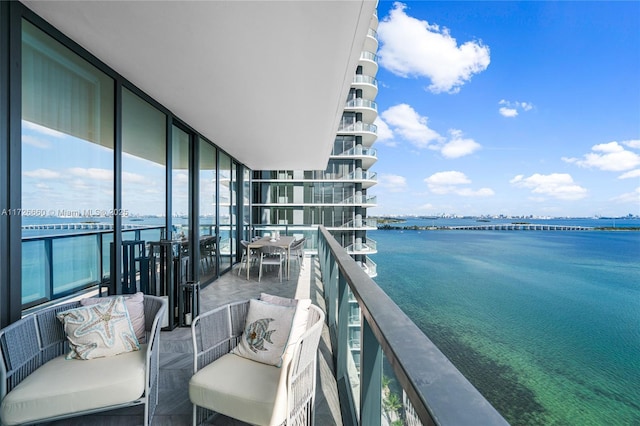 balcony featuring a water view