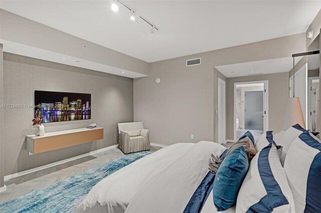 bedroom with expansive windows and parquet flooring