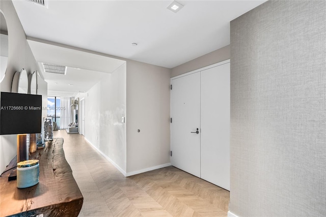 corridor with light parquet flooring