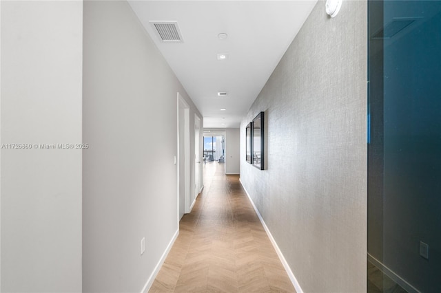 corridor featuring parquet floors