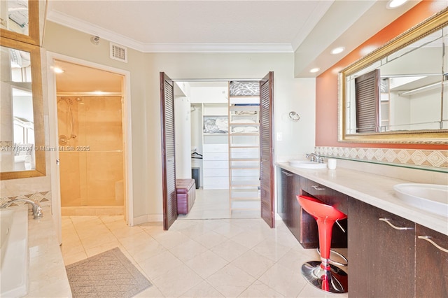 bathroom featuring tile patterned flooring, ornamental molding, independent shower and bath, and vanity