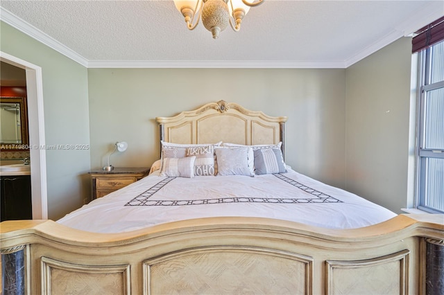 bedroom featuring crown molding, sink, and a textured ceiling