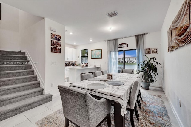 dining area featuring light tile patterned floors