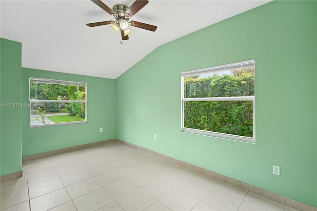 tiled spare room featuring ceiling fan and lofted ceiling