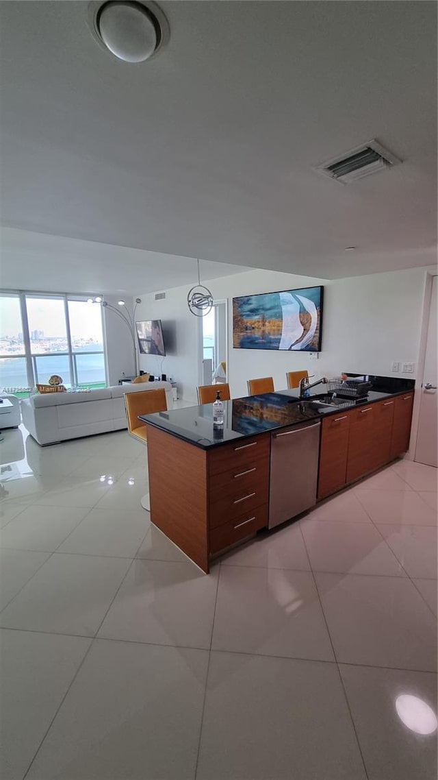 50 Biscayne Blvd Unit 1902, Miami, FL 33132 - kitchen with stainless steel dishwasher, modern cabinets, dark countertops, and a peninsula