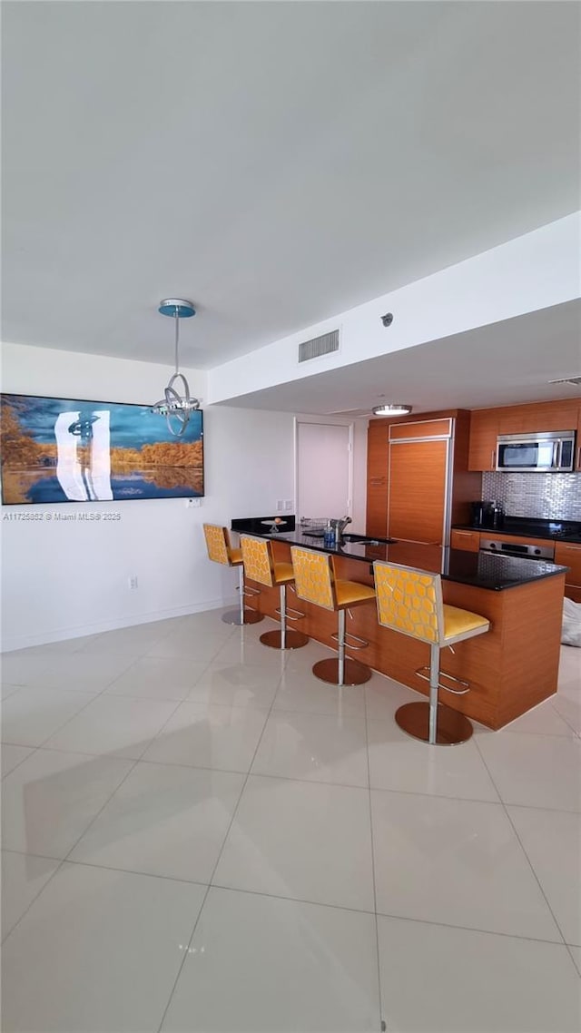 50 Biscayne Blvd Unit 1902, Miami, FL 33132 - dining space featuring light tile patterned flooring and baseboards