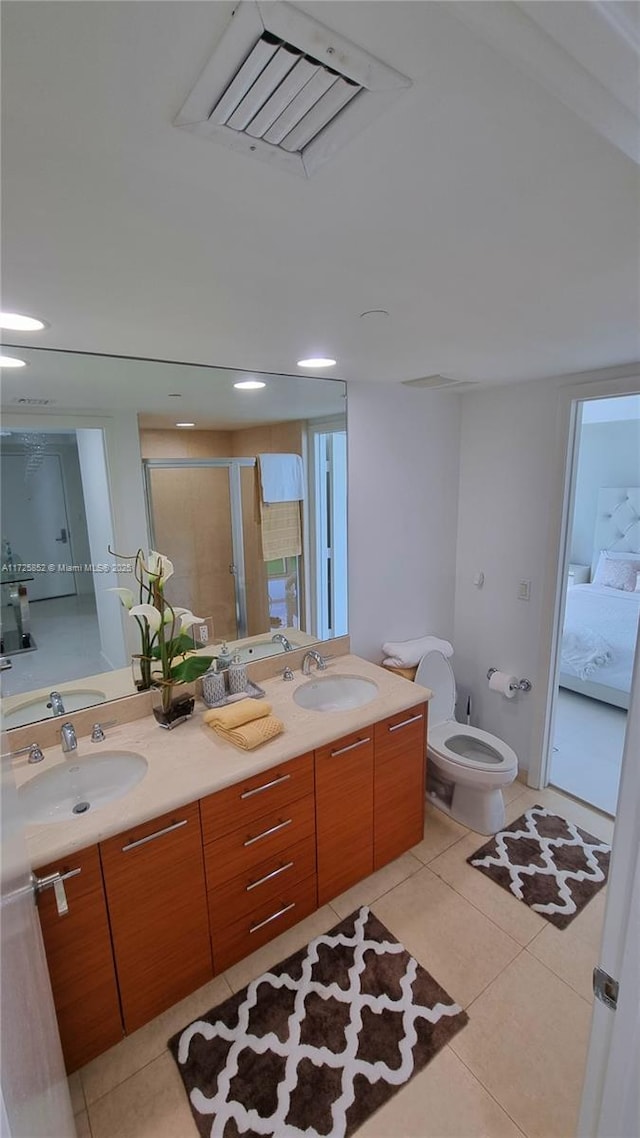 50 Biscayne Blvd Unit 1902, Miami, FL 33132 - full bathroom featuring double vanity, toilet, tile patterned flooring, and a stall shower