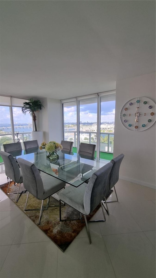 50 Biscayne Blvd Unit 1902, Miami, FL 33132 - dining room with plenty of natural light, tile patterned floors, and baseboards