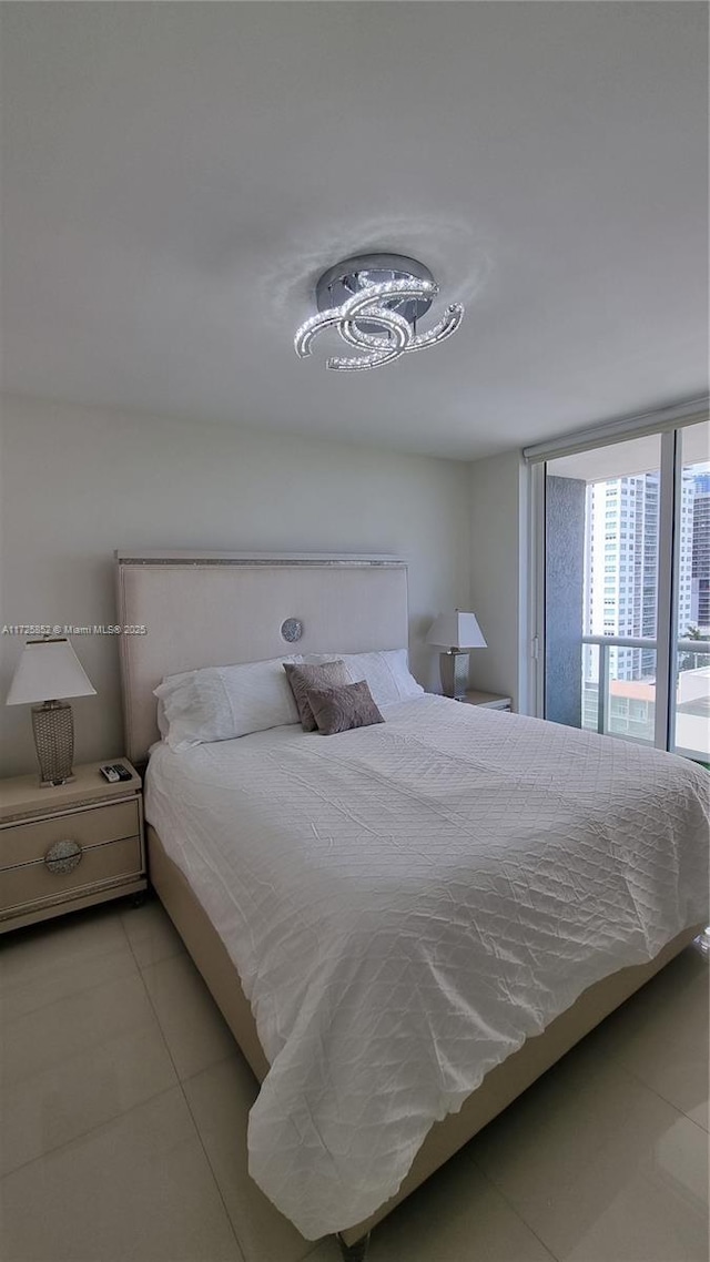 bedroom featuring light tile patterned floors