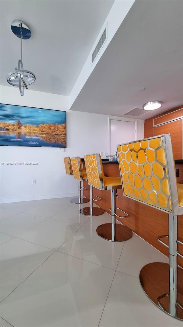 dining room with light tile patterned flooring