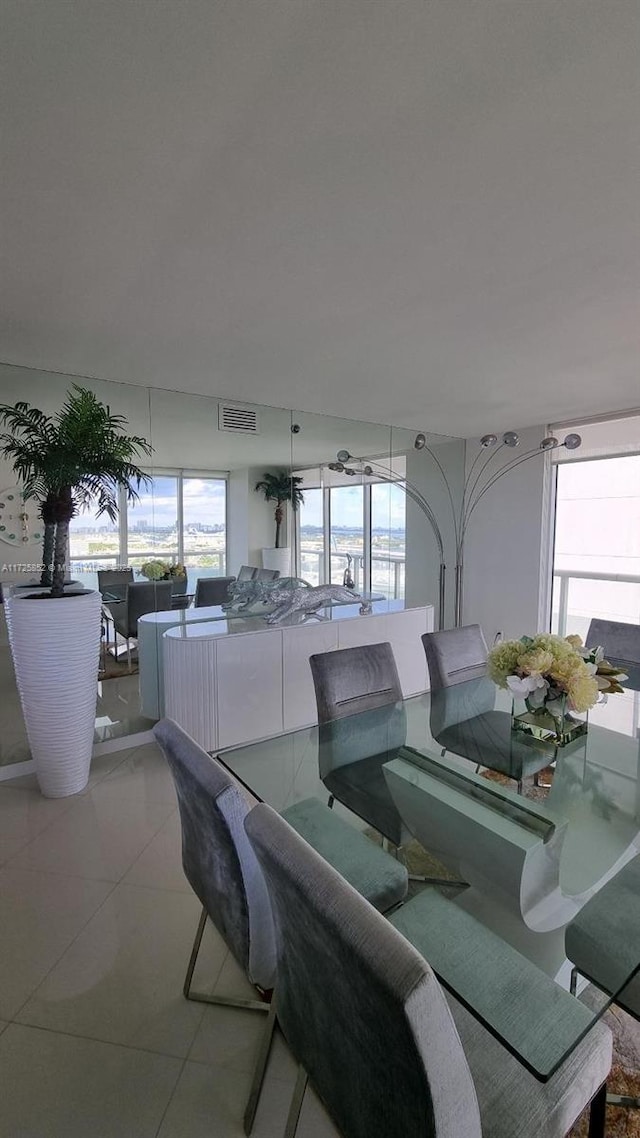 dining space with light tile patterned flooring