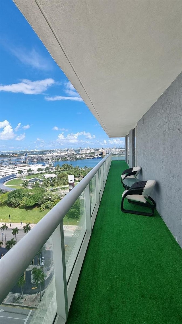 balcony featuring a water view