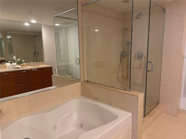 50 Biscayne Blvd Unit 1902, Miami, FL 33132 - bathroom with a stall shower, a jetted tub, vanity, tile patterned floors, and toilet