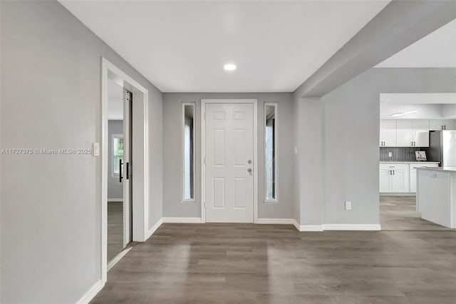 foyer with hardwood / wood-style flooring