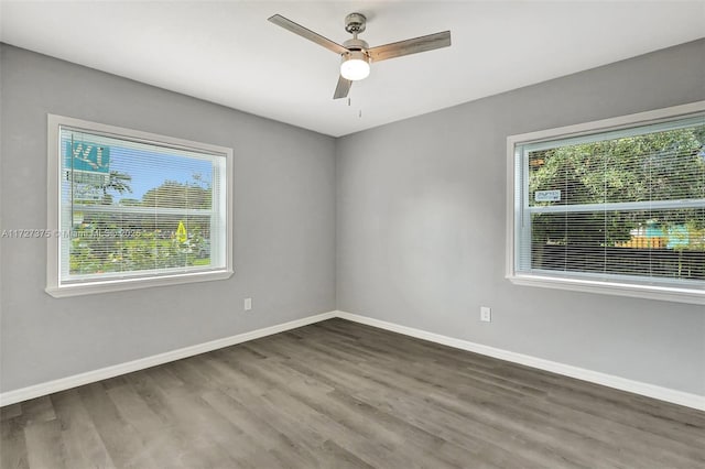 empty room with ceiling fan and hardwood / wood-style floors