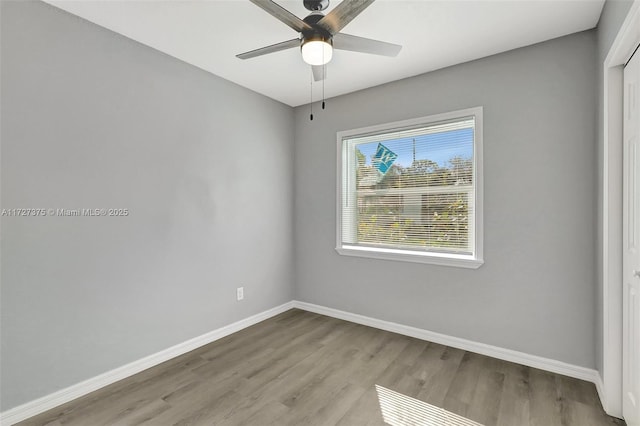 spare room with ceiling fan and light hardwood / wood-style flooring