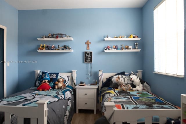 bedroom featuring hardwood / wood-style flooring