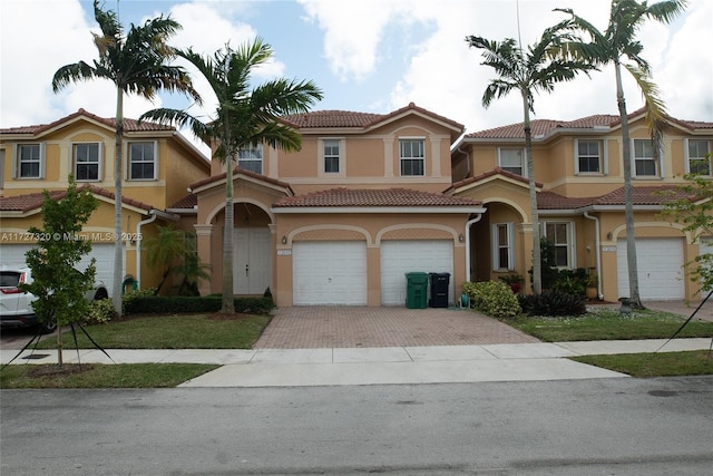 mediterranean / spanish house with a garage