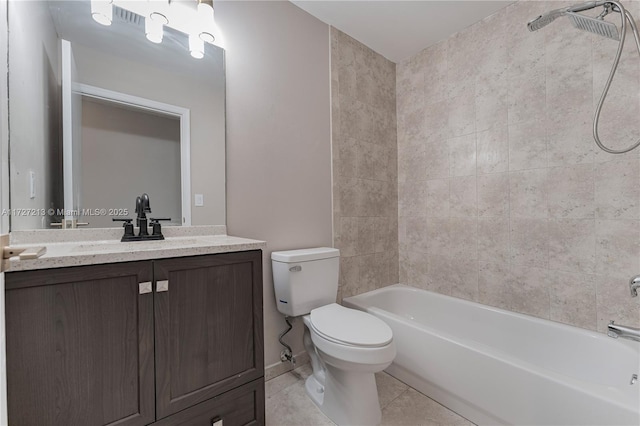 full bathroom featuring toilet, tiled shower / bath combo, tile patterned floors, and vanity