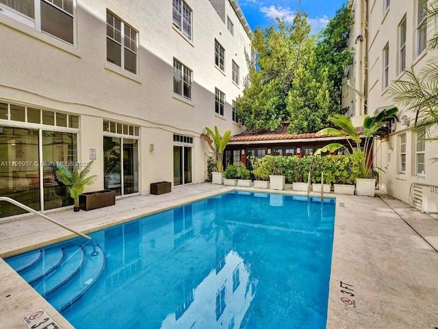 view of swimming pool with a patio