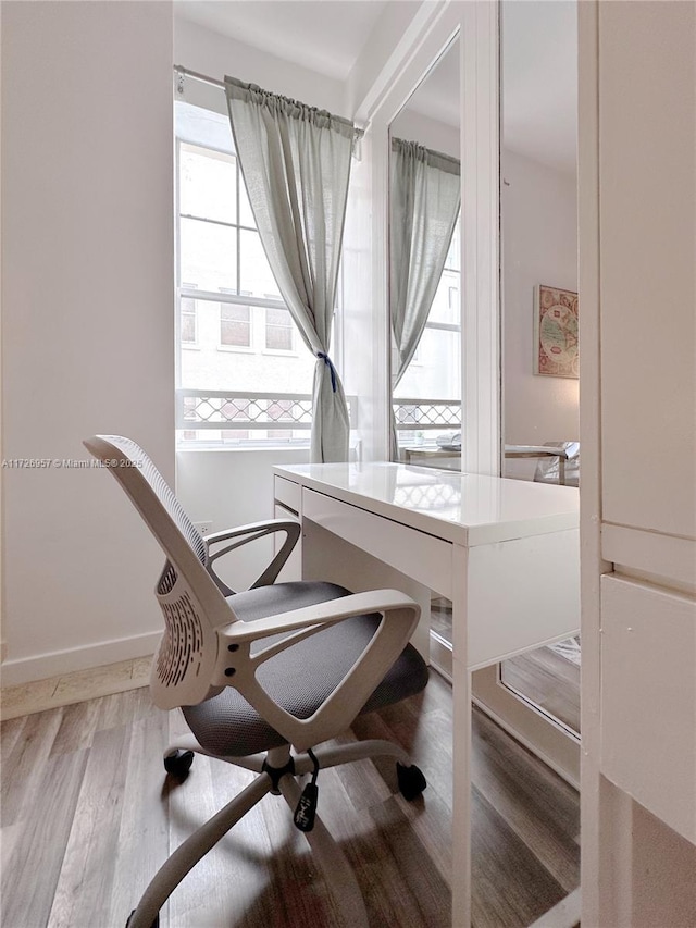 office area with wood-type flooring