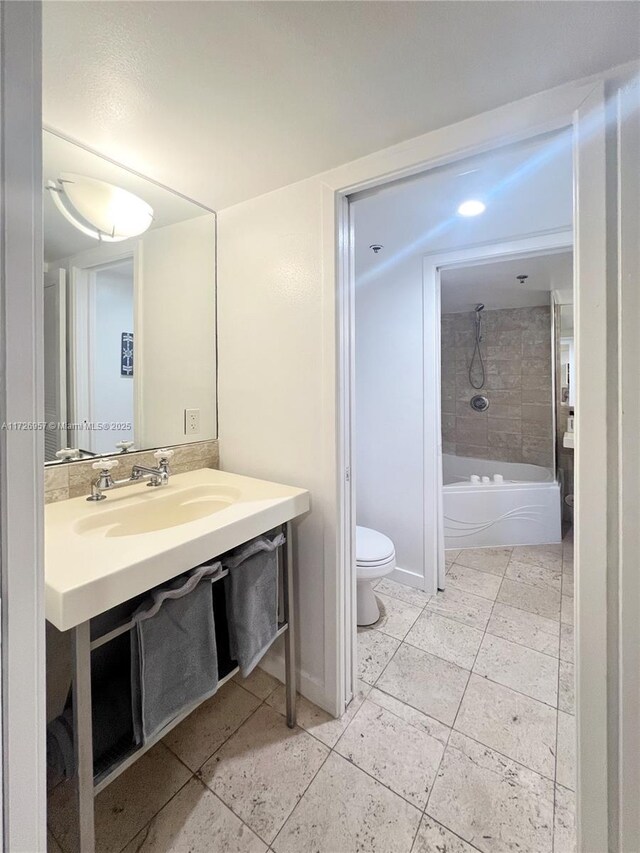 bathroom featuring sink and toilet