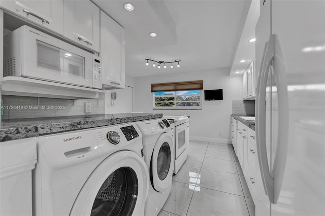 laundry area with independent washer and dryer