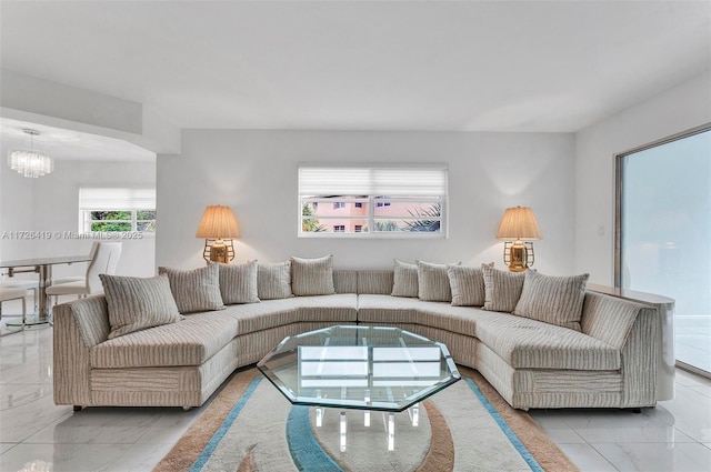 living room featuring a notable chandelier