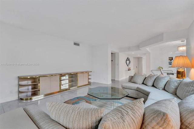 living room featuring a chandelier