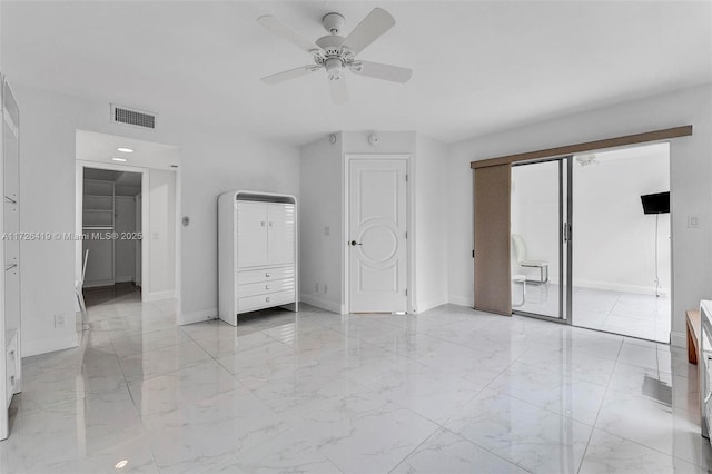 unfurnished bedroom featuring ceiling fan