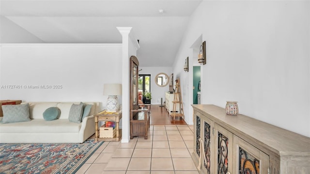 tiled living room with lofted ceiling